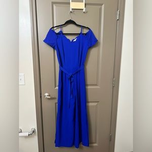 Royal Blue jumpsuit with scalloped edges. Tie waist. Slit in both legs.
